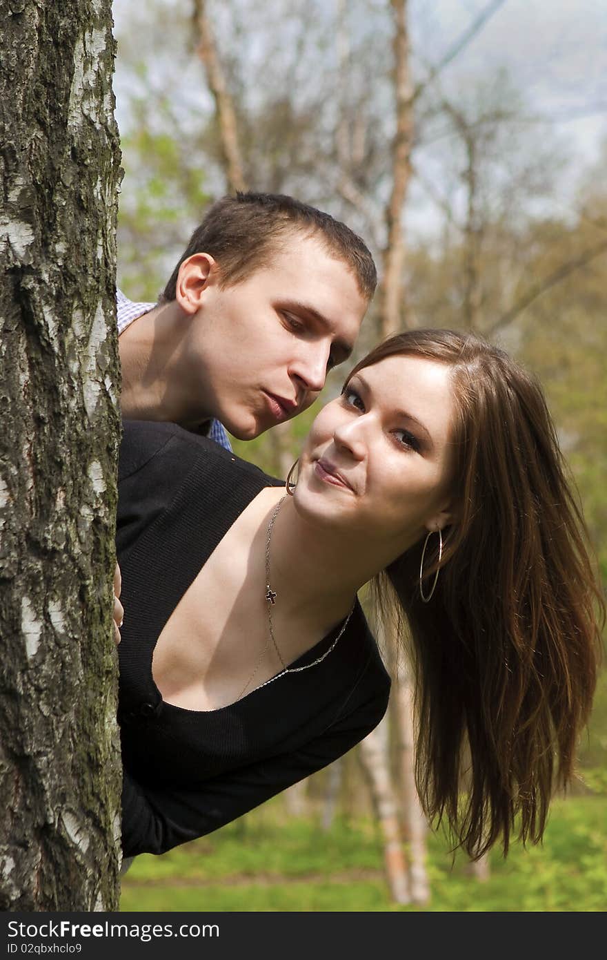 A couple in love sitting in the garden