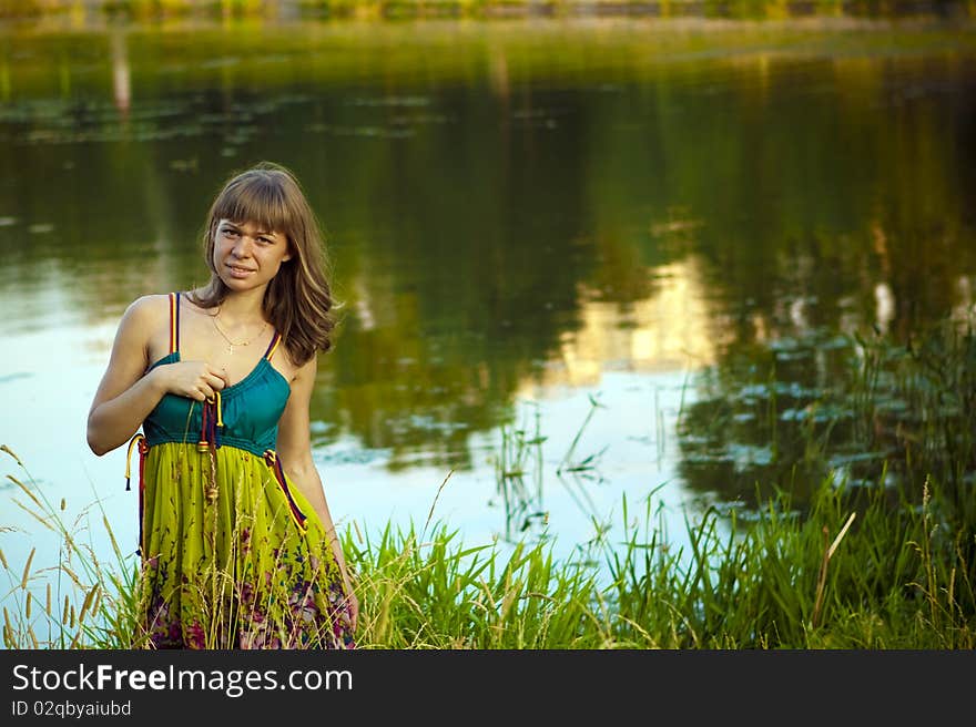 An attractive young woman walking on the lake. An attractive young woman walking on the lake