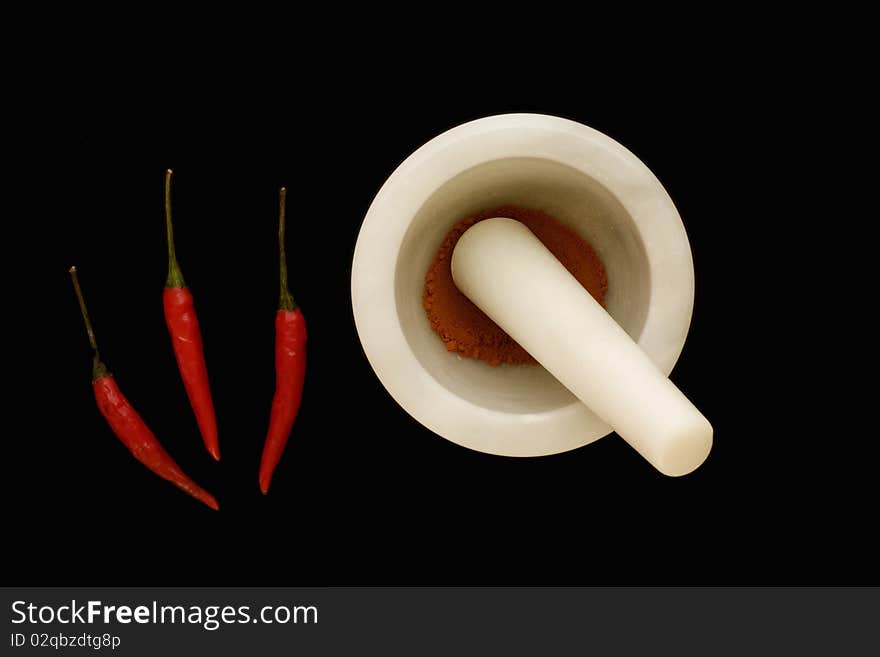 Chilli s and chilli powder in a Mortar and Pestle