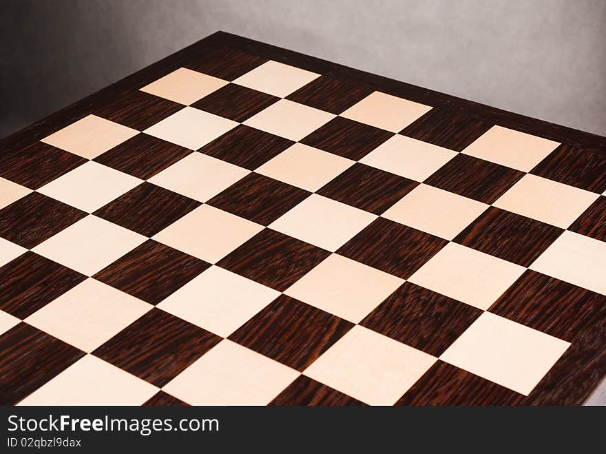 Wooden chess board on white. Wooden chess board on white