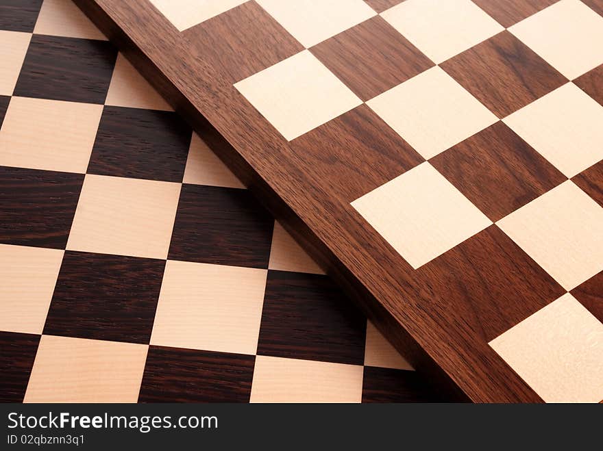 Wooden chess board on white. Wooden chess board on white