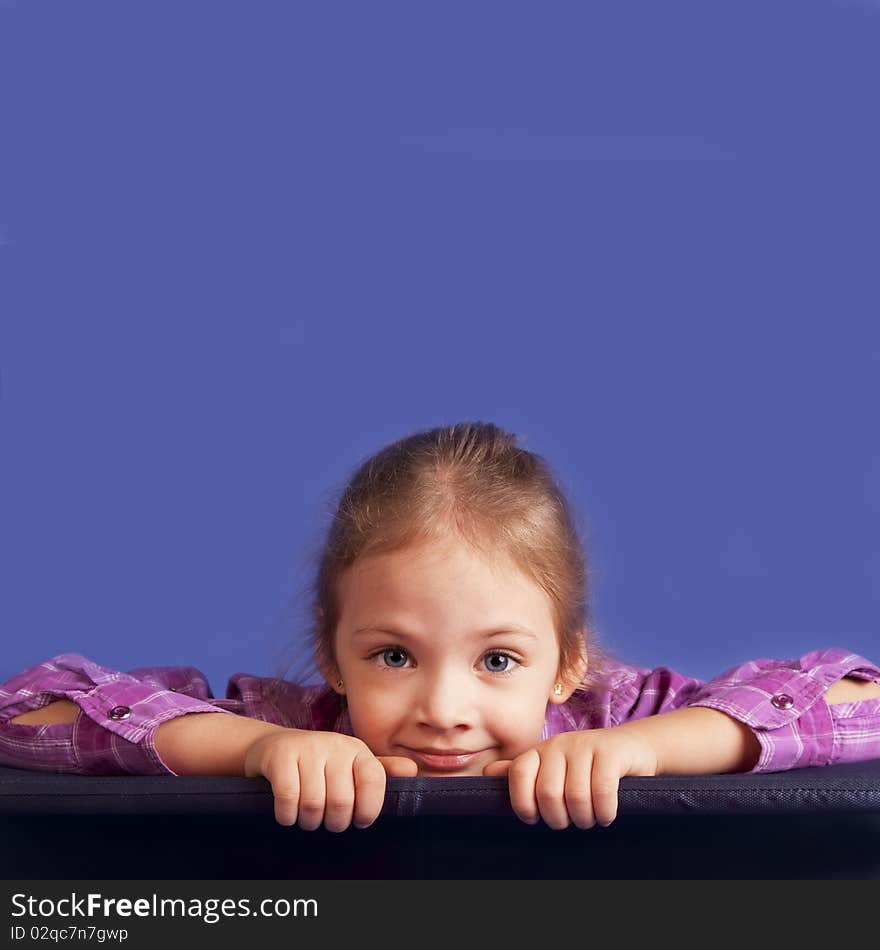 Look out girl and place for copy above her head. studio shot. Look out girl and place for copy above her head. studio shot