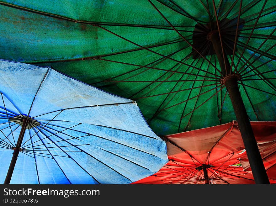 Colorful beach umbrella at a beach in thailand