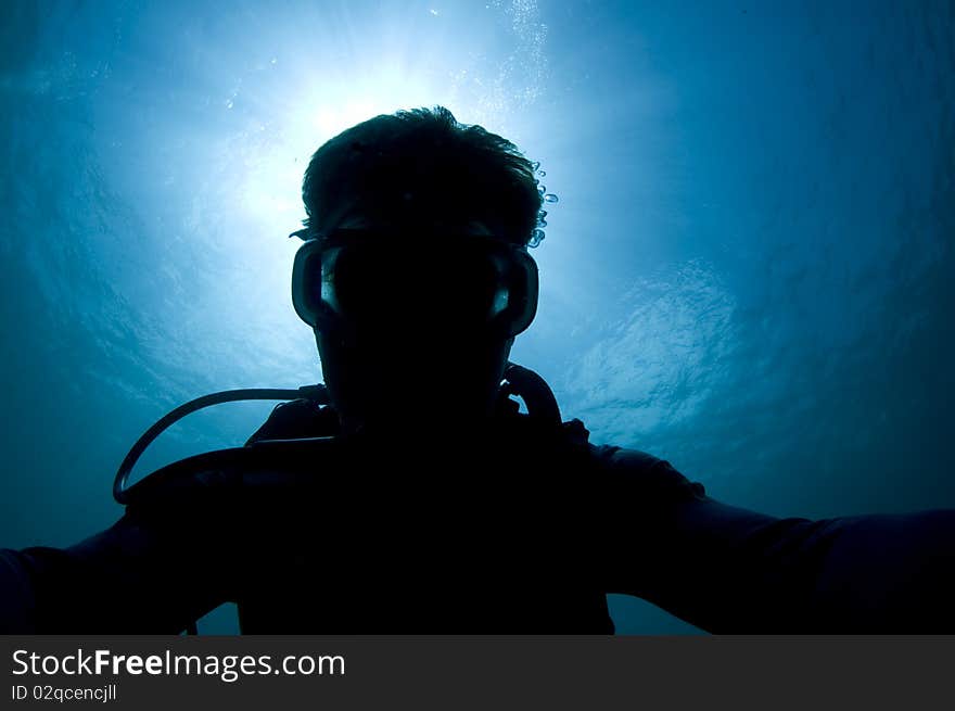 Silhouette of a diver in the Caribbean Sea