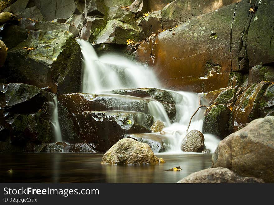 Small waterfall with gray rocks