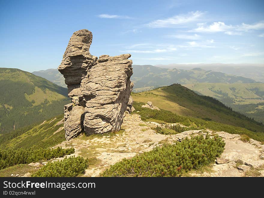 Mountain scene with a rock cliff