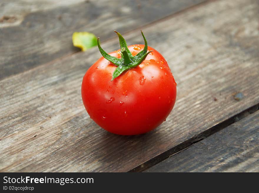 Fresh tomatoes on a wooden table