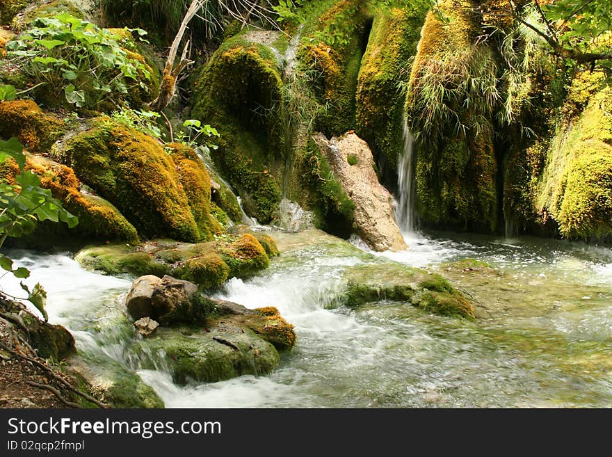 A Waterfall Flowing Into The Lake