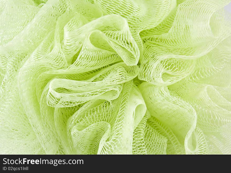 Green Plastic Bath Sponge On White Background