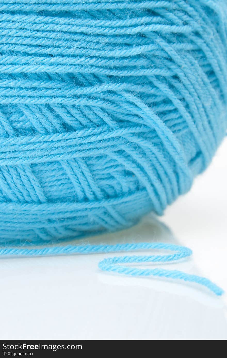 Close up image of blue ball of yarn. Close up image of blue ball of yarn.