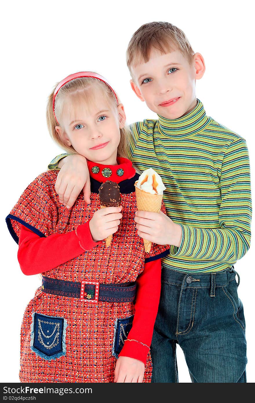 Little boy and girl are eating an ice-cream. Isolated over white background. Little boy and girl are eating an ice-cream. Isolated over white background.