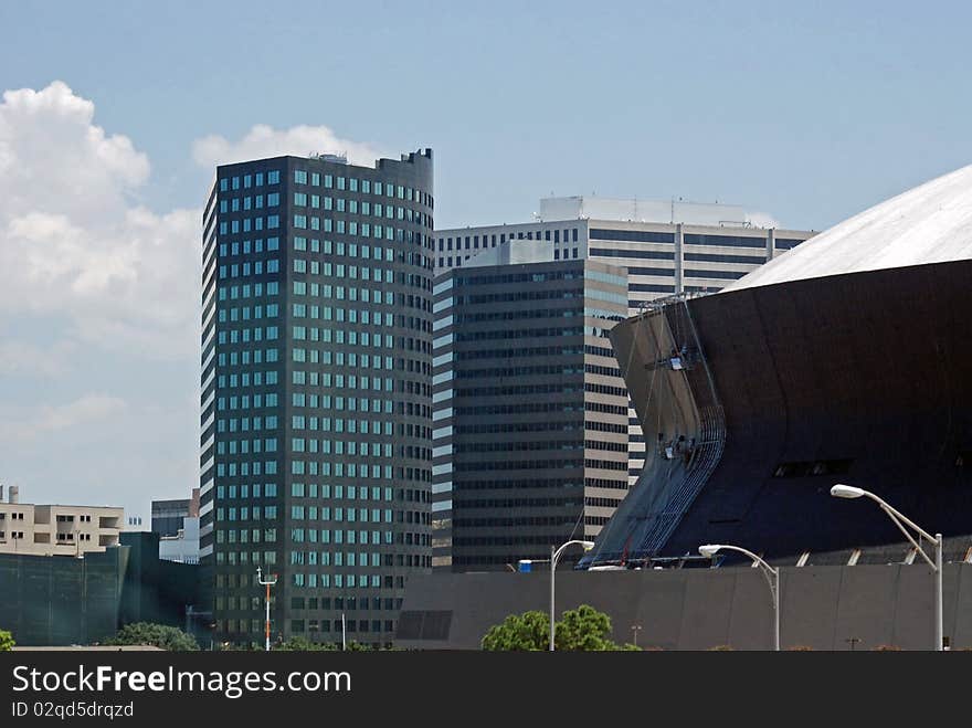 The Superdome definitely makes a statement amongst the office buildings in downtown New Orleans, Louisiana. The Superdome definitely makes a statement amongst the office buildings in downtown New Orleans, Louisiana.