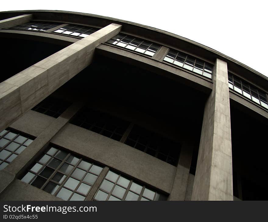 Perspective view of concrete building with windows and columns in diagonal. Perspective view of concrete building with windows and columns in diagonal