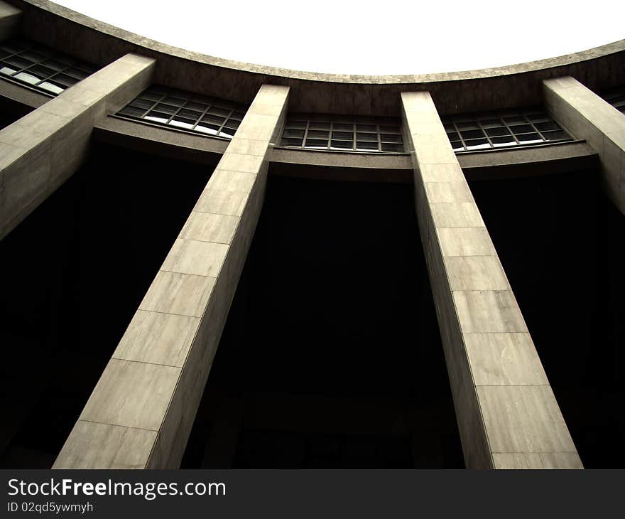 Perspective view of concrete building curve with windows and columns. Perspective view of concrete building curve with windows and columns