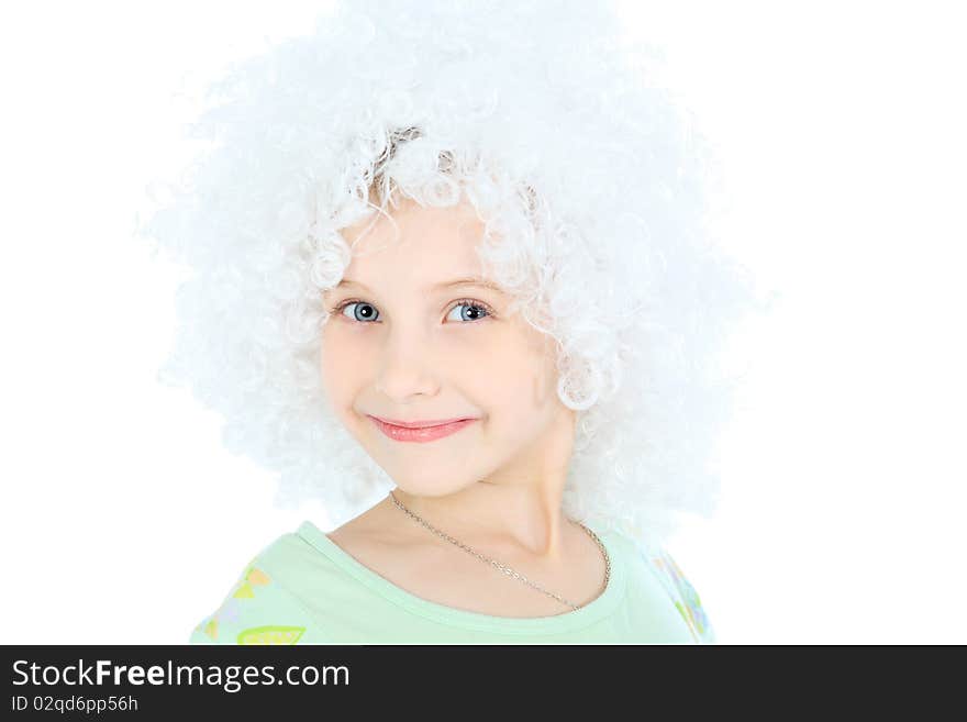 Portrait of a smiley 6 years old girl in white wig. Isolated over white background.