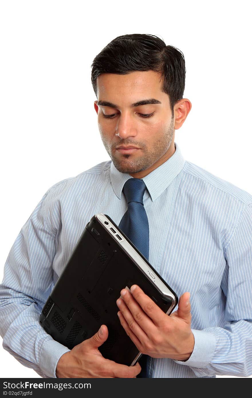 Businessman holding laptop computer