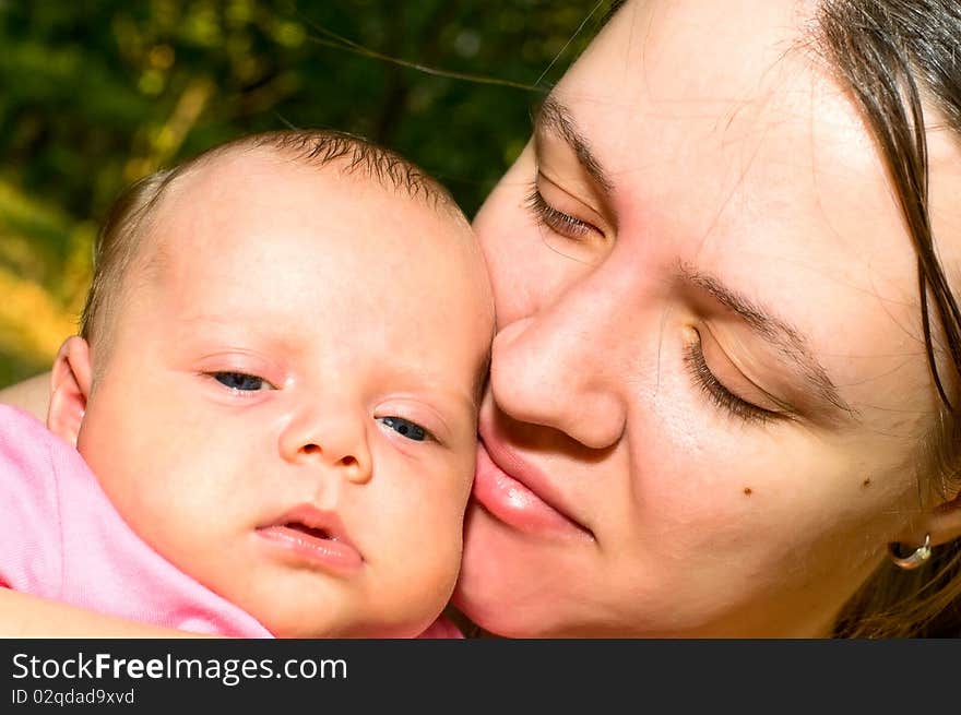 Close-up portrait of mother with child. Close-up portrait of mother with child