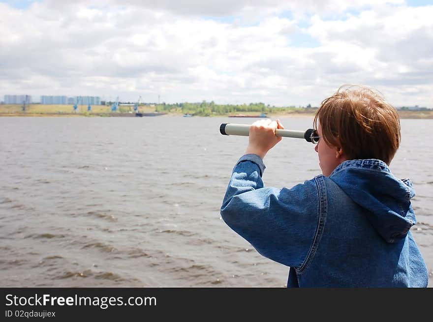 Young women aboard the ship looking through telescope. Young women aboard the ship looking through telescope