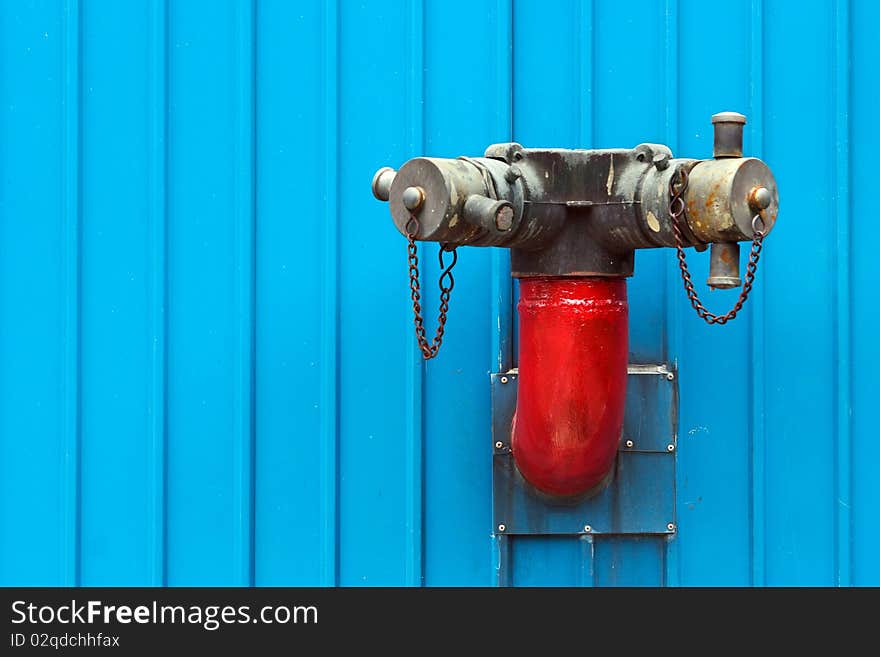 Red Fire Hydrants be side Blue Building