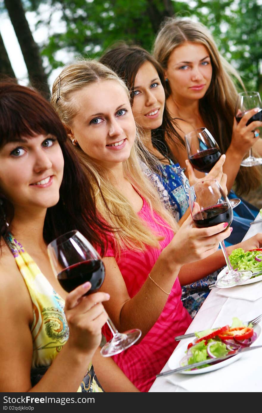 Group of beautiful girls drinking wine