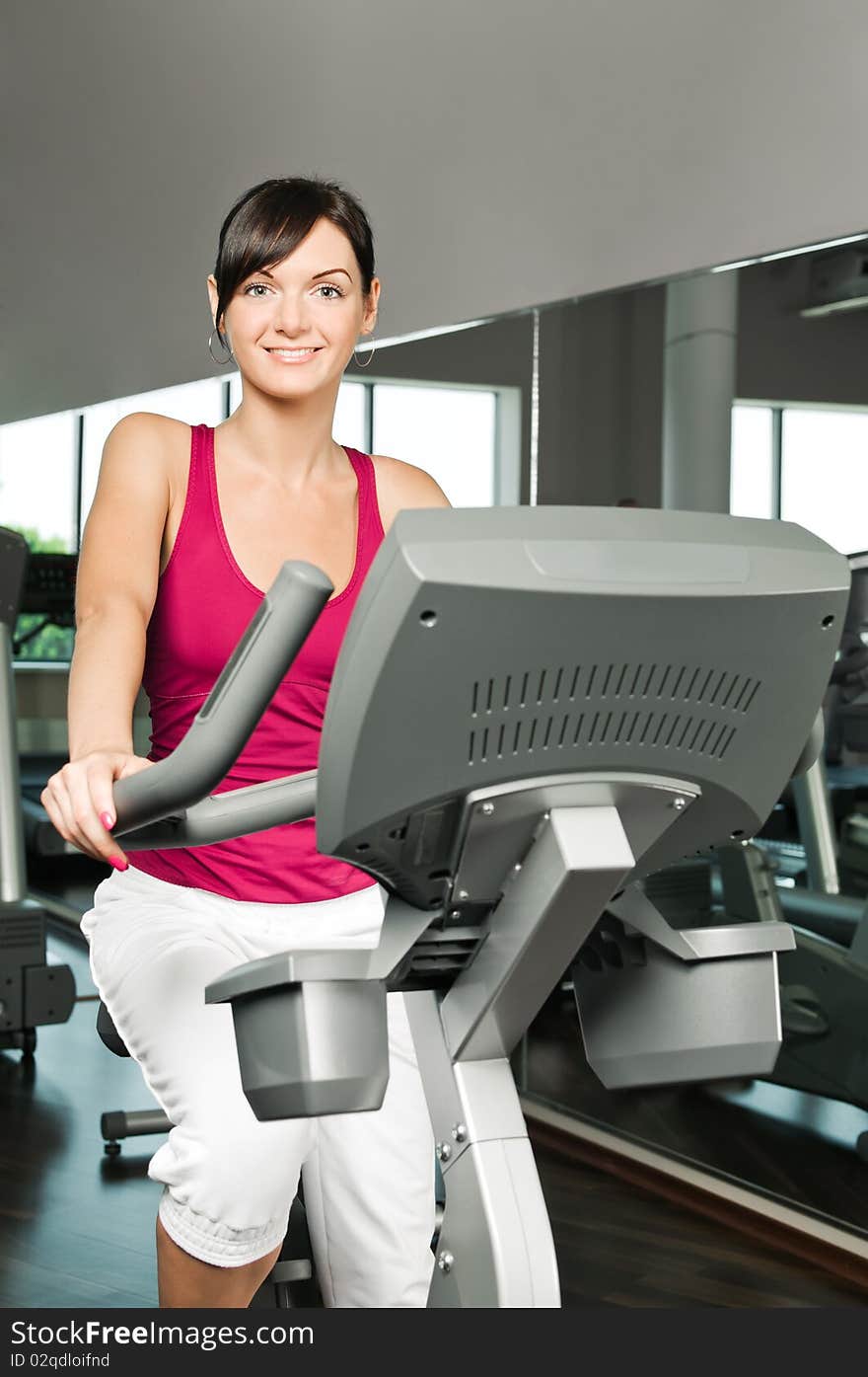 Young woman at the fitness club