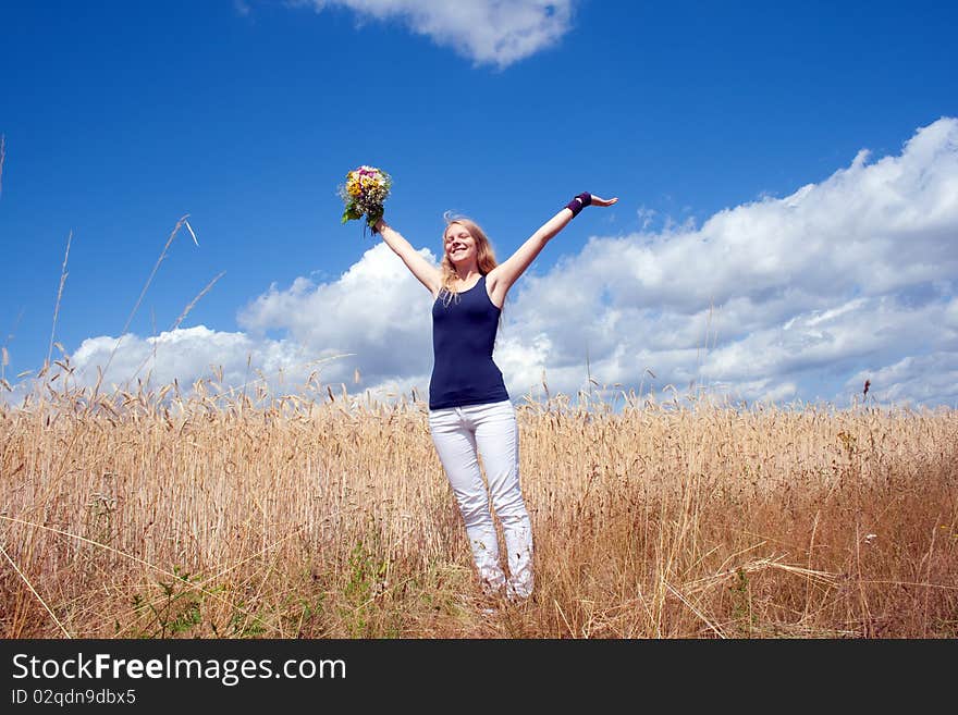 Young happy woman with a bouquet. Young happy woman with a bouquet