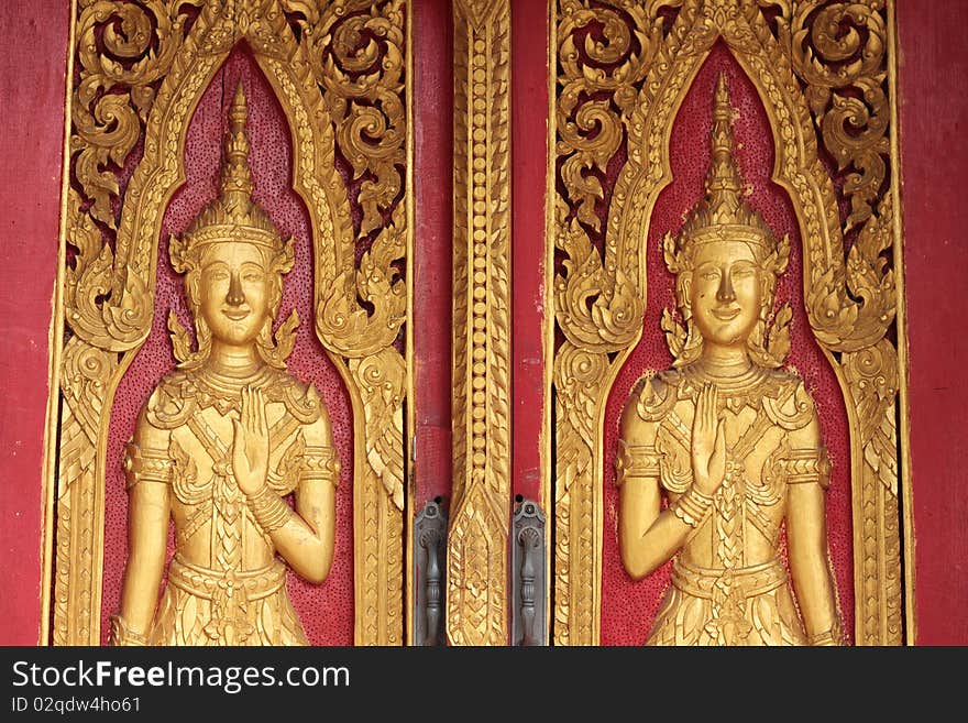 Traditional Thai style molding art
on the door in temple