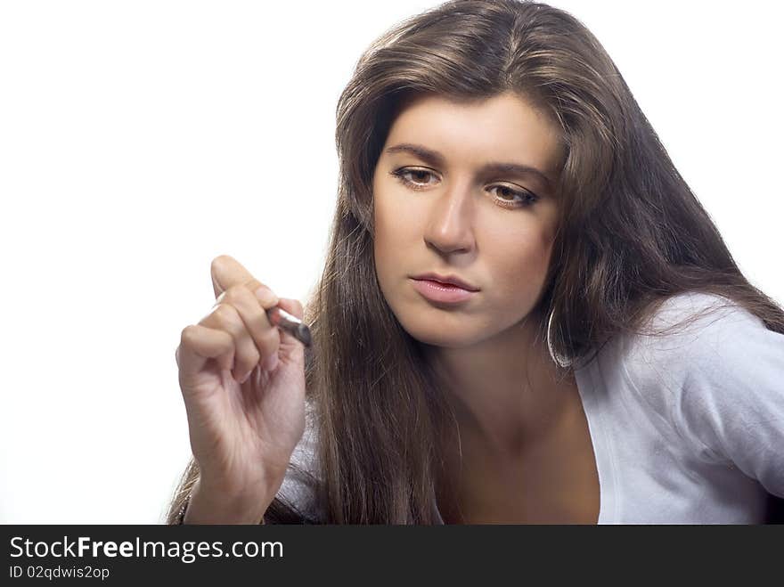 Young brunette makeup artist with brush at work