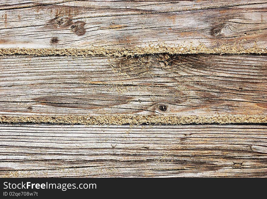 Weathered wooden boardwalk texture close-up. Weathered wooden boardwalk texture close-up