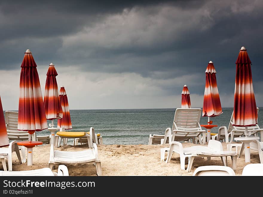 Beach With Deckchairs And Parasols Sea