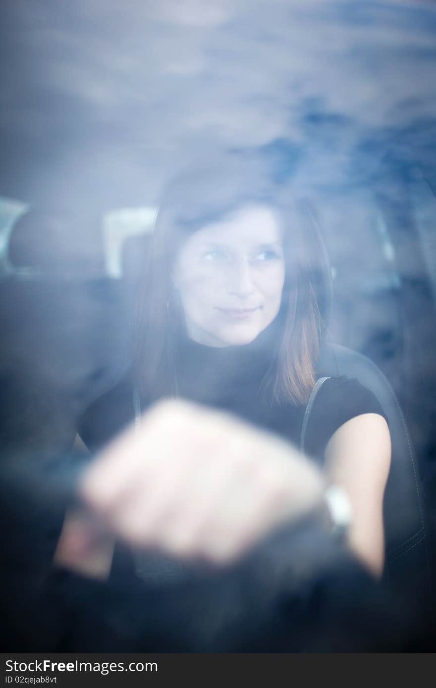 Pretty Young Woman Driving Her  Car