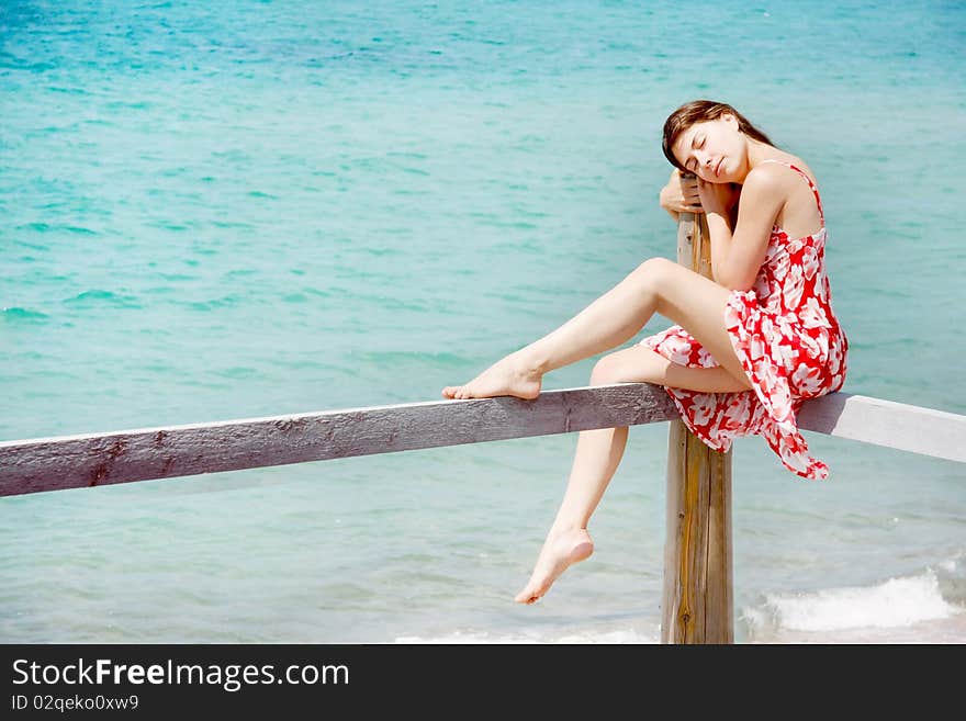 Dreaming girl on sea background