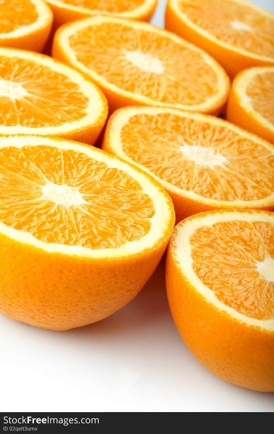 Orange halves on white background