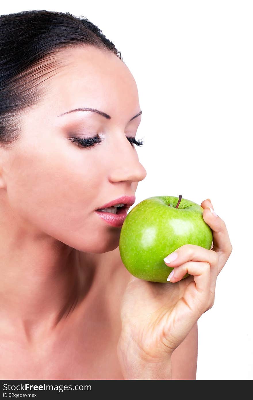 Beautiful woman with green apple in hand