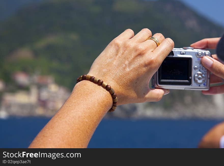 Woman taking picture of the mountains