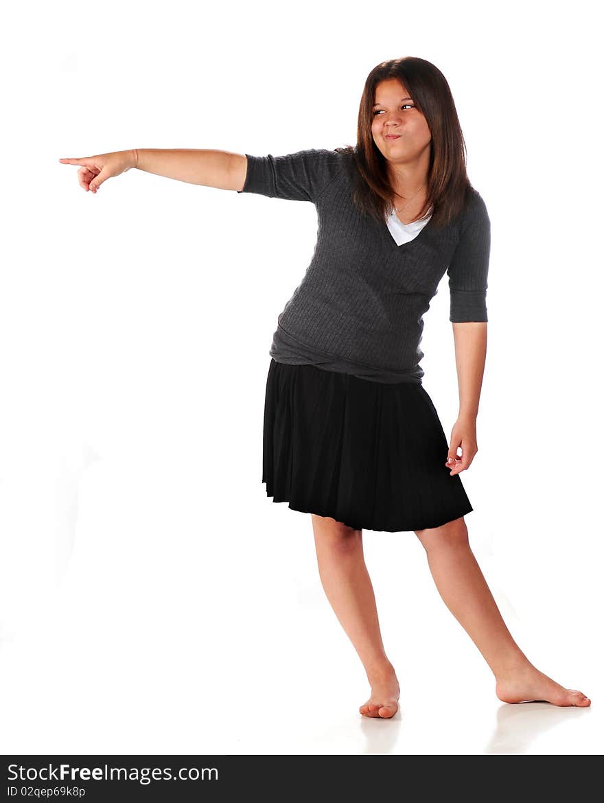 Full-length portrait of a silly young teen pointing into the distance. Isolated on white. Full-length portrait of a silly young teen pointing into the distance. Isolated on white.