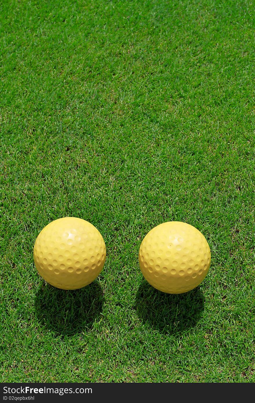 Two ceramic golf ball on green grass