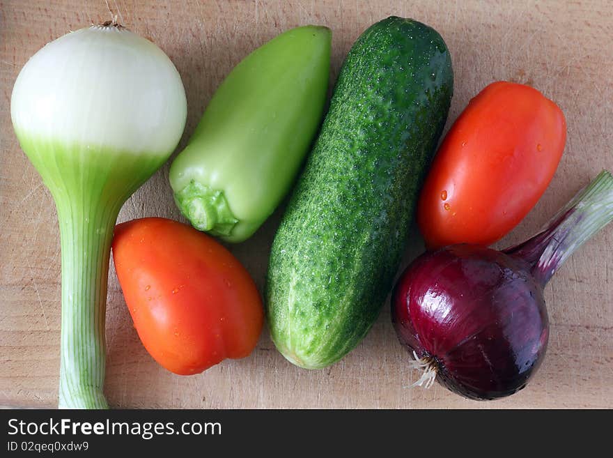 Fresh raw vegetables on a cutting board. Fresh raw vegetables on a cutting board