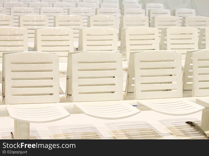 A line of white chairs