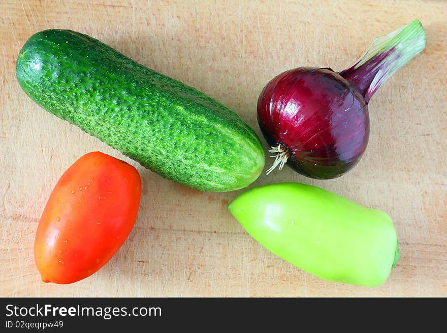 Fresh raw vegetables on a cutting board. Fresh raw vegetables on a cutting board