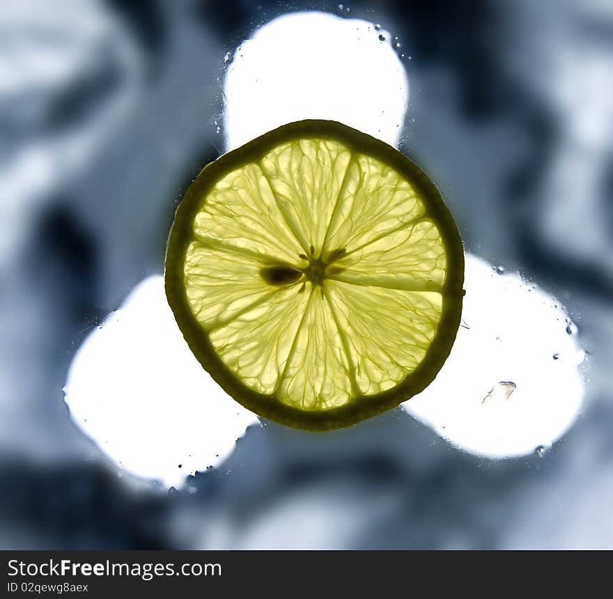 Single Lemon Slice On The Wet Surface