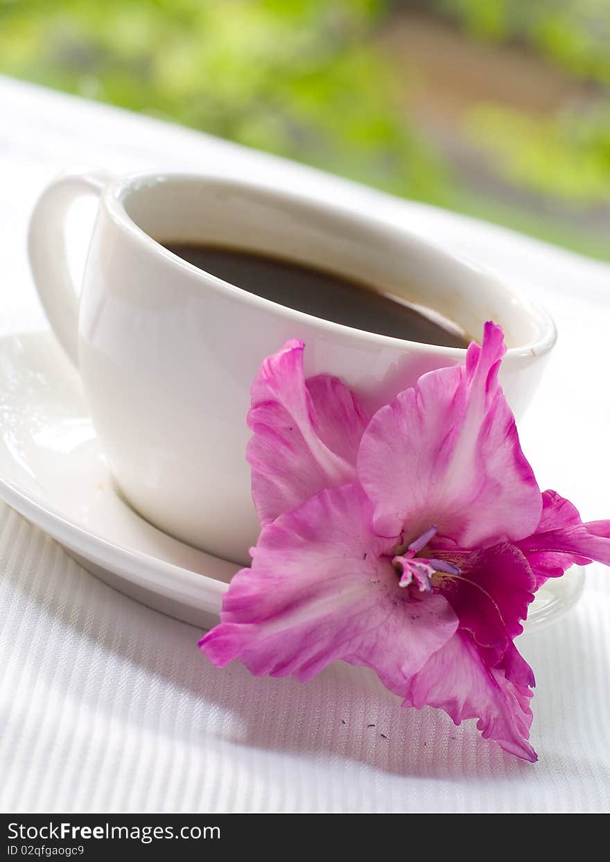 Cup of coffee with flower