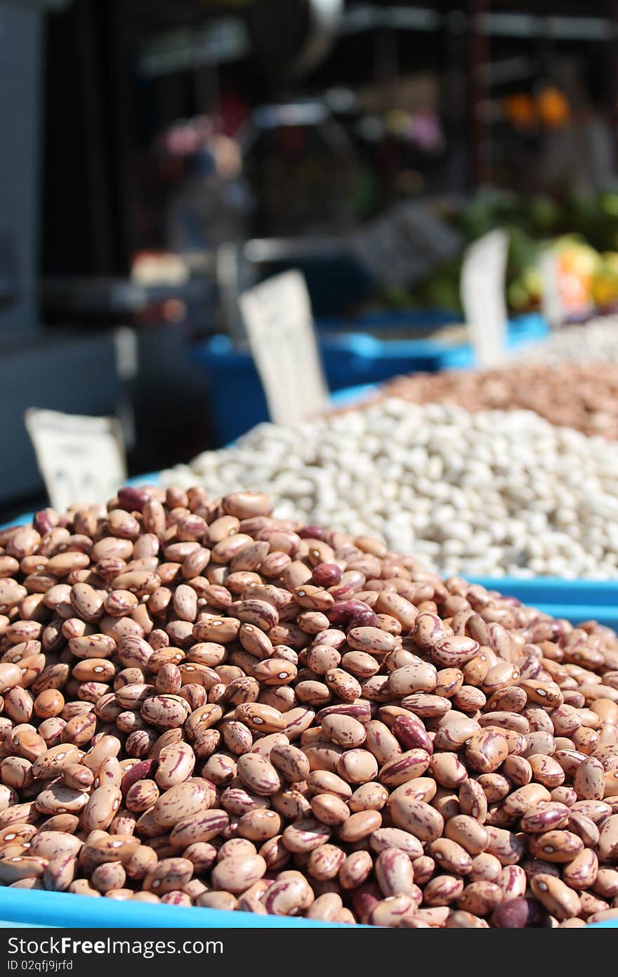 grains of brown beans exposed on market place. grains of brown beans exposed on market place