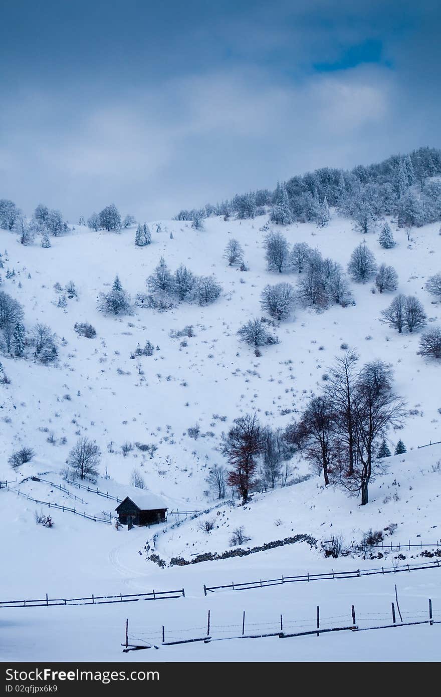 Isolated House in Mountains in Winter