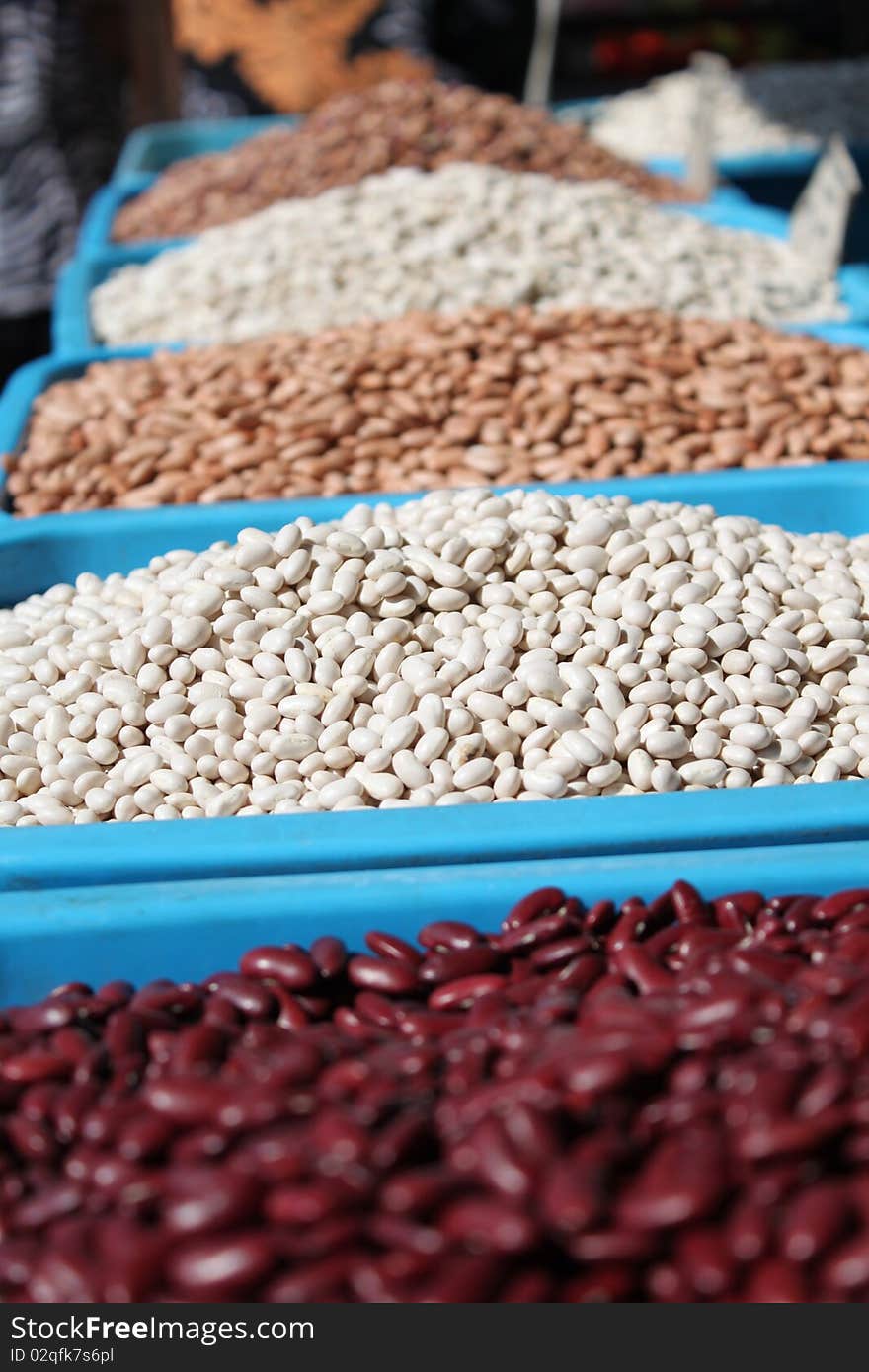 White grains of beans exposed on market-place