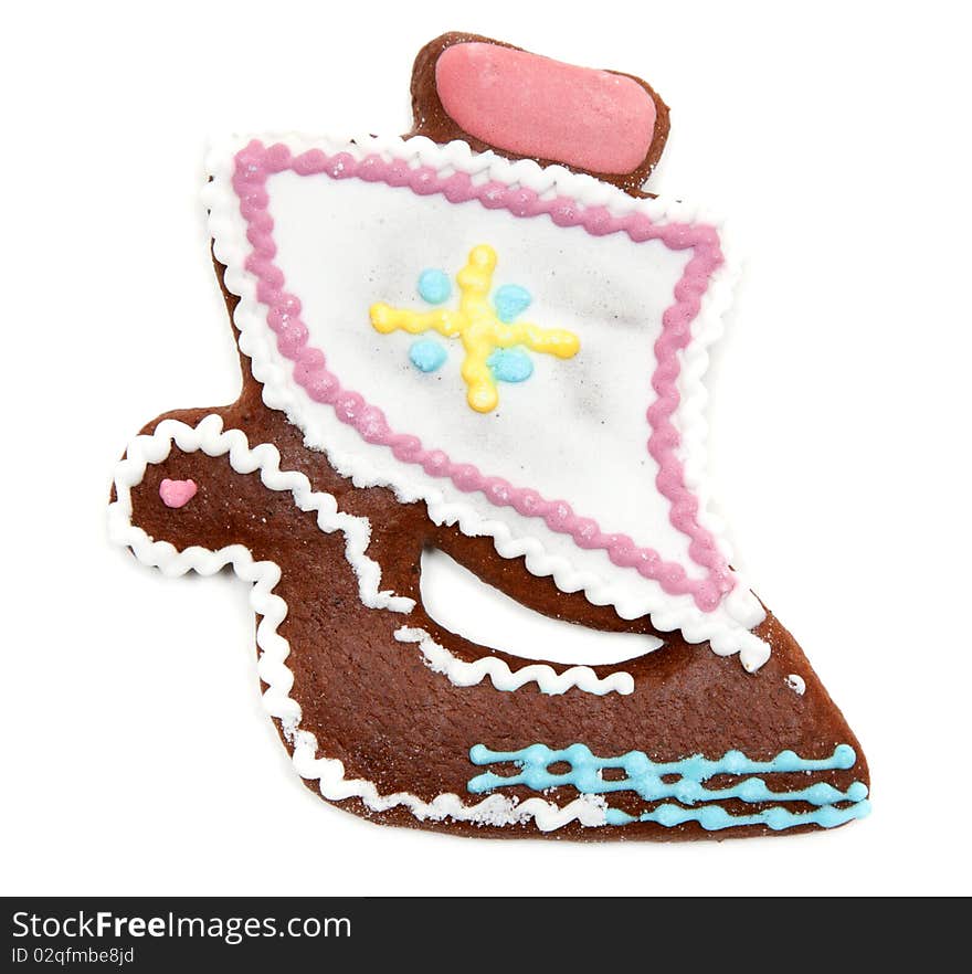 Gingerbread in form decorated by glaze sailfish on white background