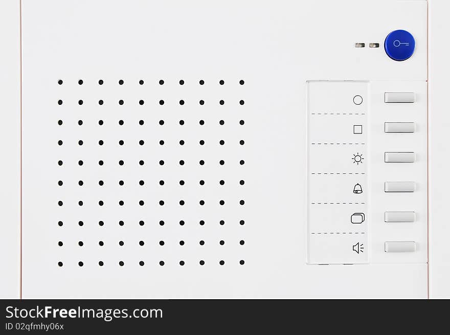 Closeup of a modern electric doorbell system with speaker and some buttons. Closeup of a modern electric doorbell system with speaker and some buttons