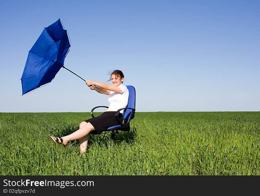 Business Women With An Umbrella On A Grass Land