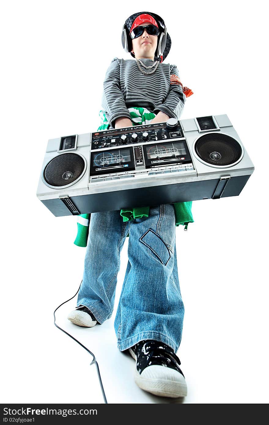 Shot of a trendy teenager listening to music in headphones. Isolated over white background. Shot of a trendy teenager listening to music in headphones. Isolated over white background.