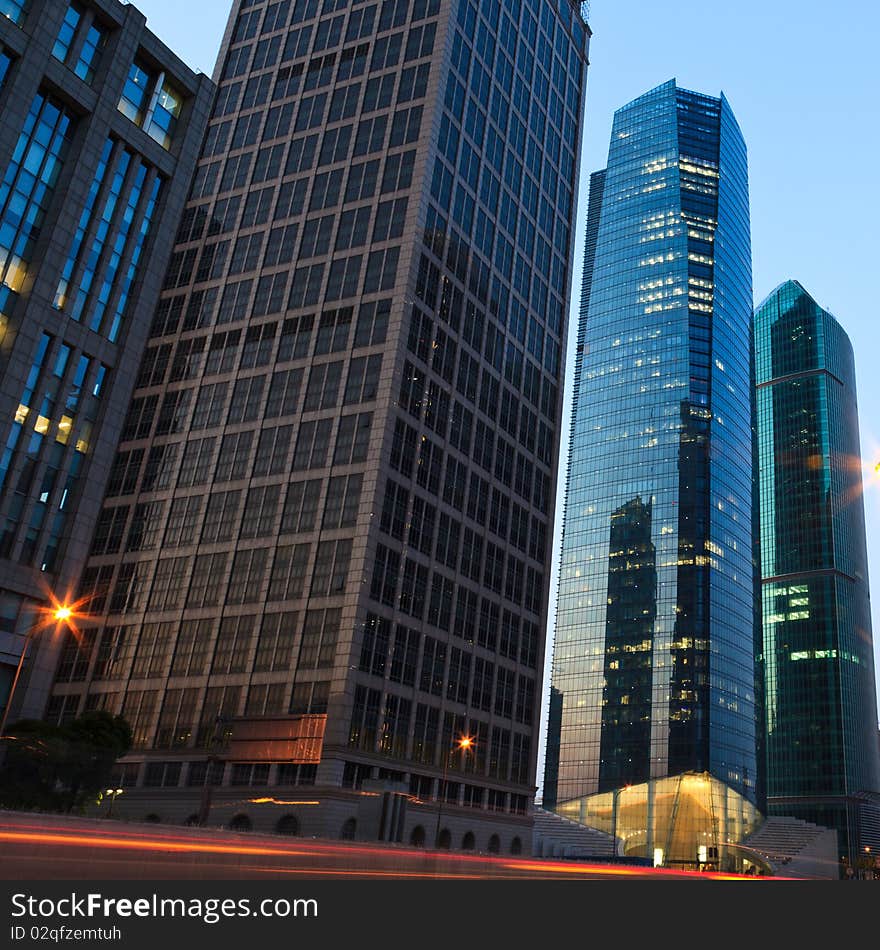 The light trails on the modern building background in shanghai china.